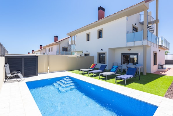 Private heated pool (winter months) with sunbeds laid out