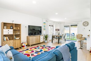 Lounge view towards garden and dining table/kitchen