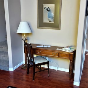 Writing table with adjacent stairs to king loft