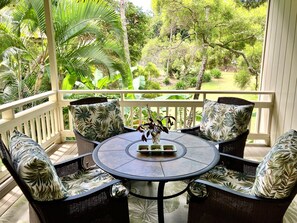 Spacious lanai with tree top garden view