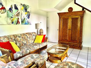 Living room with LG OLED smart TV, AC and ceiling fan