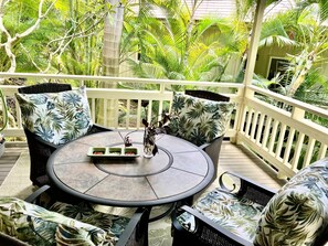 Lanai surrounded by lush foliage filled with bird songs
