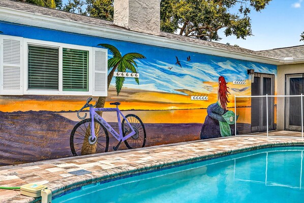 Signature mermaid mural overlooking the beautiful private pool