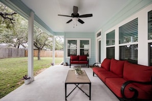 Back patio equipped with a propane grill