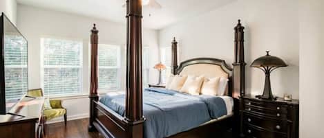 Master Bedroom has a king bed, 2 night stands, a ceiling fan & large smart t.v.