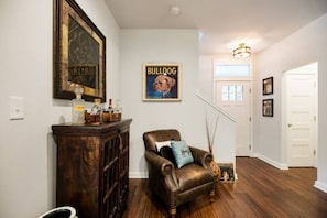 Sitting area near liquor cabinet.