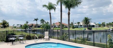 Great place to relax next to the pool & waterway.
