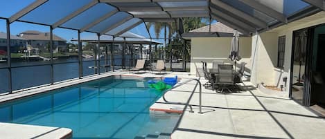 Salt water/heated pool large 6 person table with firepit in center