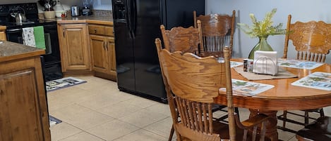 Fully stocked kitchen and dining area 