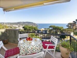 Sky, Plant, Furniture, Property, Water, Chair, Building, Seaside Resort, Table, Azure
