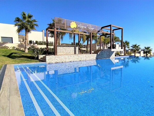 Sky, Water, Swimming Pool, Plant, Building, Azure, Shade, Outdoor Furniture, Tree, Sunlounger