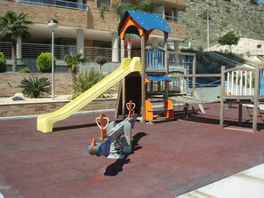 Plant, Building, Shade, Leisure, Recreation, Chute, Playground Slide, Outdoor Play Equipment, Playground, Urban Design