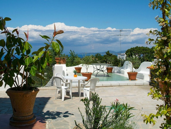 Cloud, Sky, Plant, Property, Furniture, Flowerpot, Chair, Arecales, Outdoor Furniture, Tree