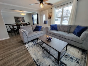 100 yr old arched doorway. Remodeled living/dining room, lights, door & windows.