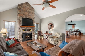 Living room with gas fireplace and large screen TV