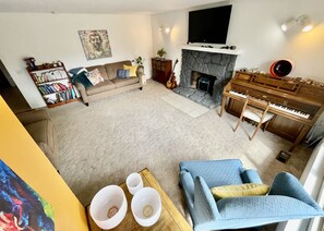 Living Room w/ Piano, books, Smart TV, Netflix, Disney, Amazon Prime. 