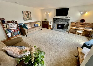 Living Room w/ Piano, books, Smart TV, Netflix, Disney, Amazon Prime. 