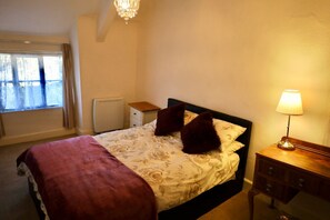 Main bedroom with space for travel cot