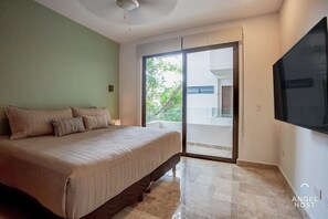 Plush king-sized bed & Smart TV in the room w/access to another private balcony