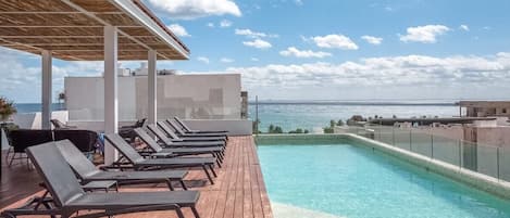 An incredible rooftop infinity pool with ocean view at the complex!