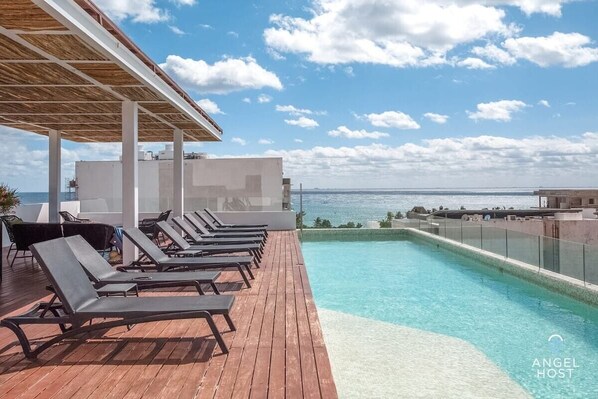 An incredible rooftop infinity pool with ocean view at the complex!