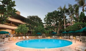 Enjoy an evening cocktail while lounging around a sparkling pool!