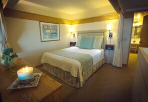 Unwind in a queen comfy bed after a long day with optional privacy curtains!