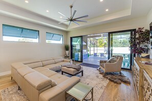 The living room opens into the patio for indoor-outdoor living