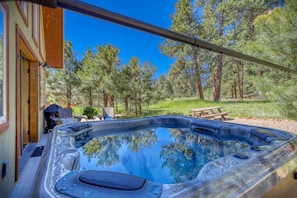 Relax in the hot tub while enjoying nature's wonderful view!