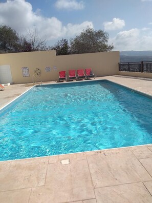 Well maintained pool for use by Christina Hilltop guests, sun loungers provided
