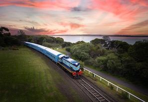 Watch the trains roll by from the porch
