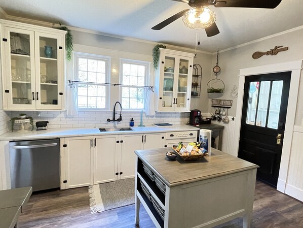 Charming kitchen with original cabinets yet with all of the modernized touches.