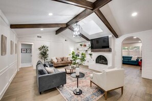 Modern and rustic with high vaulted ceilings, this living room was designed with sophistication in mind!