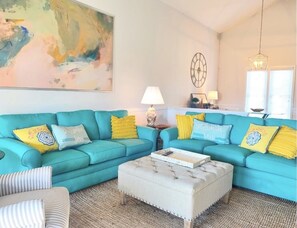 Living Room w/ direct access to screened porch. Large screen smart tv with cable