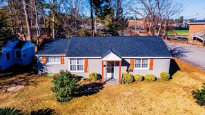 Single-level home with cedar accents, ample parking for cars, boats, and an RV