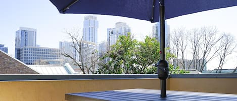 Outdoor Patio with Seating and Downtown Views.