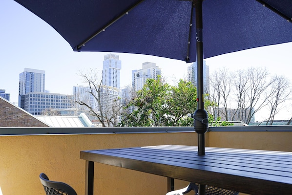 Outdoor Patio with Seating and Downtown Views.