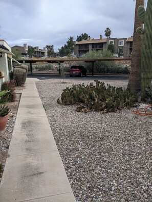 One covered spot for cars or several uncovered spots closer to the Casita