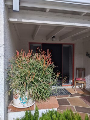 Covered entry Veranda with Wicker sofa and Outdoor table