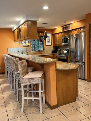 Main Level - Chef's Kitchen. 5 Burner Gas Range. Seating for 8.