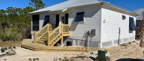 Welcome to Unit 6015 - This brand new cottage offers 3 bedrooms, 2 bathrooms and a large screened porch.