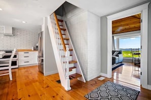 Stairs to sleeping loft. Family room to the right.