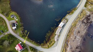 left side pond/lake, right sandy beach, lobster traps, dead end road in between