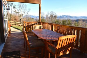 Enjoy your morning coffee or evening meal on this spacious deck with a dining table seating for six. Relax and soak in the stunning scenery of the Blue Ridge Mountains. 