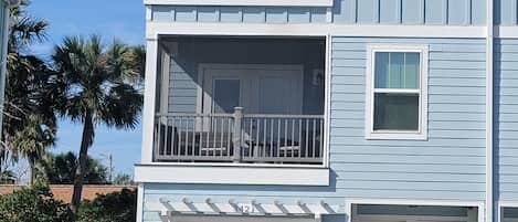 Relax and enjoy the ocean air on one of two balconies.