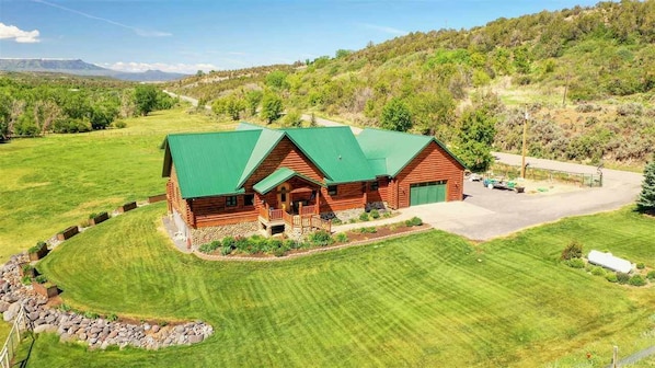 Enjoy a lush, well-maintained lawn at this quiet, luxury log home