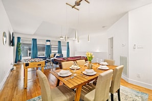 Spacious dining table that sits 6 with full tableware and silverware included.