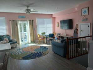 Lots of living room windows plus access to the 3rd floor deck! Light & airy!