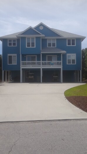 Our home, and your vacation retreat, is the left unit. Each side fits 3-4 cars.