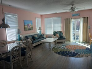 Lots of living room windows plus access to the 3rd floor deck! Light & airy!